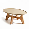 Table basse ovales en bois clair et surface beige dimensions 100 x 60 x 40 cm
